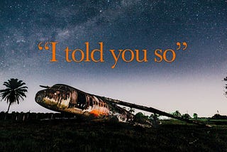 The wreck of a crashed plane with the phrase “I told you so” in large letters.