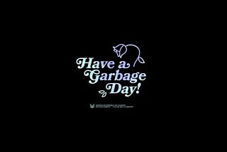 A black screen with the words “Have a Garbage Day!” written on it underneath what seems to be a wilting tulip.