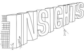 Three people working together to construct the word ‘insights’ written in large letters