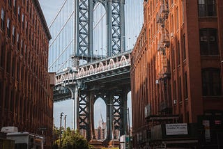 Washington Street in DUMBO Brooklyn looking out at the Manhattan Bridge and Empire State Building