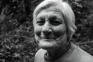 smiling older woman in black and white