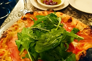 Pizza at Lil’ Frankie’s. Thick, sourdough base, topped with prosciutto and rocket.