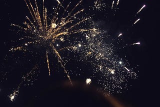 fireworks exploding in a night sky