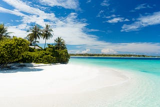 Beautiful island with a azure blue sea and white beach. The world gave us places like these, what we give it back is an ocean