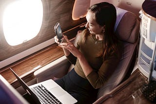 a woman in a business class flight