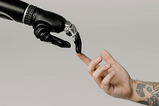 Robot hand touching human hand