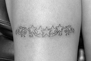 Unveiling the Magic: Star and Swirl Line Tattoos