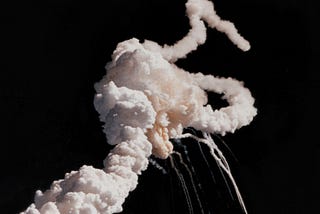 Challenger space ship exploding, white ribbons of smoke
