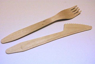 A wooden knife and fork, the kind they give you at take-out diners these days.