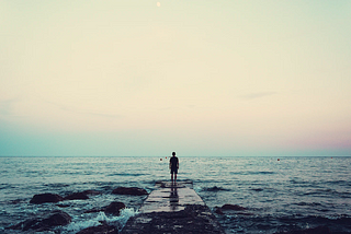 Lone man looking at the horizon