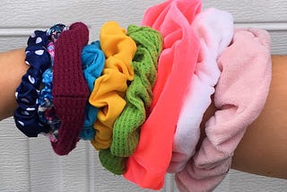 Nine scrunchies on my wrist. Each a different, vibrant color.