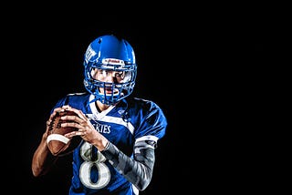 A quarterback getting ready to make a pass