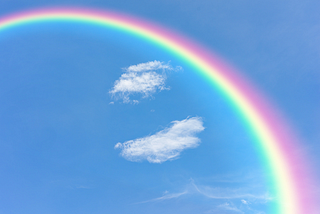 A Rainbow Forms In The Sky.