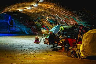 A group of Tents set up inside a tunnel