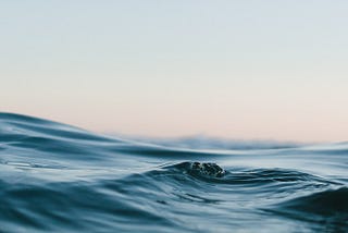Body of water under sky. Photo by Matt Hardy via Unsplash.