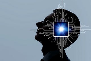 A silhouette of a man’s head with a computer chip superimposed with network wires extending from it. Photo by metamorworks/Getty Images