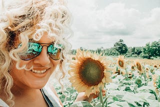 Female with a sunflower