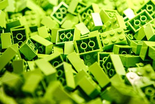 A pile of lime green lego blocks.