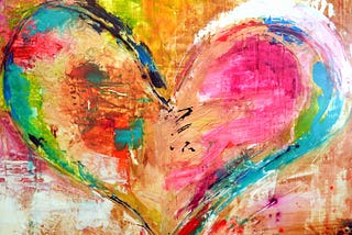 A heart painted in a variety of bold colors.