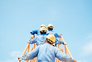 Construction workers with protective hats