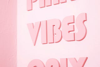 A pink background with the words “Pink Vibes Only” written on it. Spiritual Bypassing