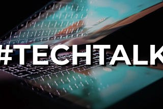 Decorative Image — bold white text: #TECHTALK over a stylised photo of a partially opened bright laptop screen