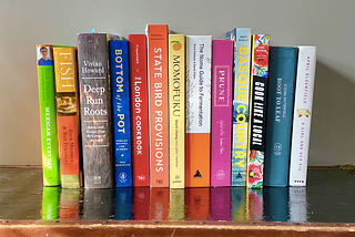 cookbooks on shelf illustrating use of cookbook search engine eat your books