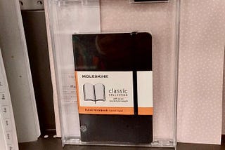 Moleskine notebook in glass case