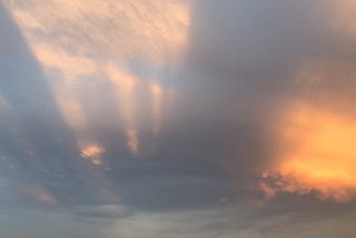 Long shadows in clouds at sunset
