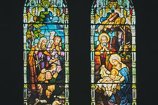 Two stained glass images of the nativity scene