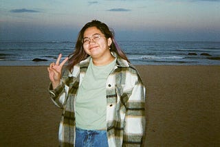 Picture of Meredith Quintana with the backdrop of a beach