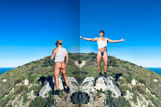 man standing on top of mountain