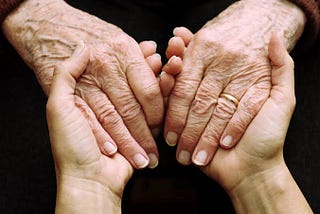 Young and Old —  hands in hand.