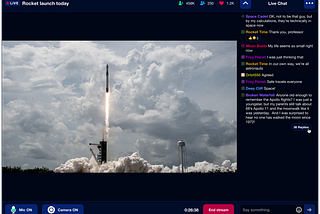 A livestream video of a NASA launch with an accompanying chat including threads and replies.