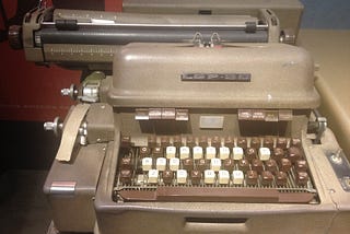 A Flexowriter, which is a machine resembling a typewriter used to generate punched ASCII code tapes for use in early computers and numerically controlled machine tools.