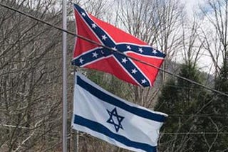 Confederate flag and Israeli flag fly together.