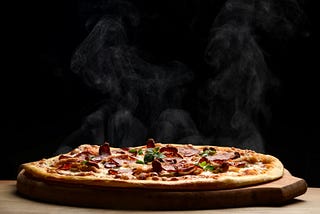A photo of a pepperoni pizza on a wooden board