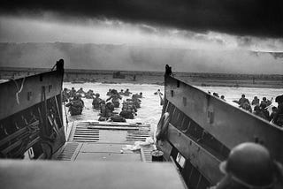 A picture of soldiers exiting a landing craft at Omaha Beach on D-Day