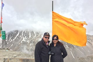 On top of the Khardungla Pass with my husband Shakti-Photo by Author