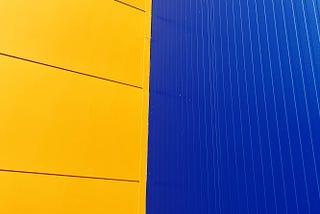 Photo from Ikea of a yellow and blue wall meeting at the middle.