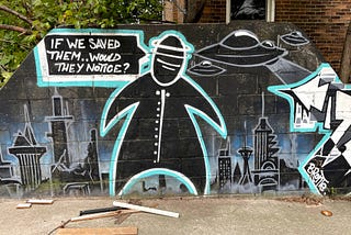 Mural artwork featuring a black blob person with the thought bubble, “If we saved them…would they notice?” while UFOs attack a city.