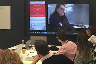 Team members observe a mobile prototype testing session