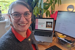 Picture of the author at her desk with computer screens