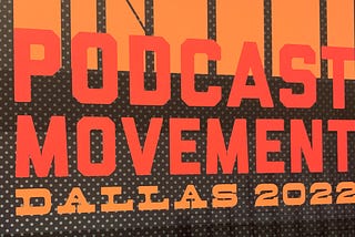 An image of the Podcast Movement Dallas 2020 logo from a sign at the conference