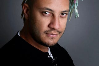 Headshot of Moonlair360, author’s son Blake Scott, with turquoise dreadlocks and soulful eyes.