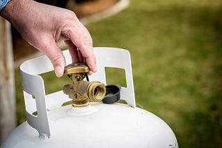 opening the valve of a propane cylinder