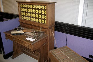 A wooden 1890 tabulation machine with dials.