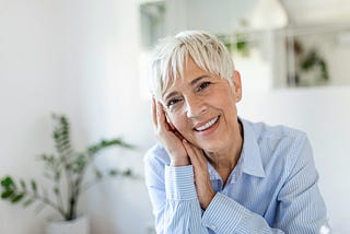 Older women looking into the camera, relaxed and smiling