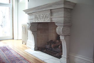 Are you looking for some unique carved stone fireplace mantels?