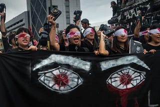2019 Chileian  Activists protests the police’s targeting of protesters’ eyes with rubber bullets (Photo credit: Nicole Kramm)